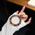 Serene Haven Smoky Quartz Bracelet with Fine Silver Lotus Charm (12mm)